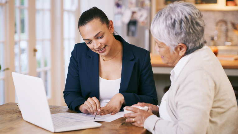 An advisor and her client reviewing tax planning strategies for the year ahead.