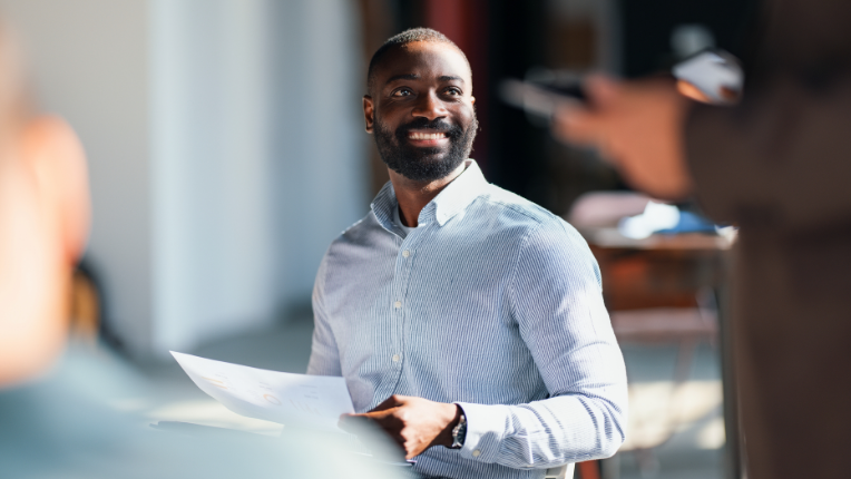 Man holding a piece of paper.